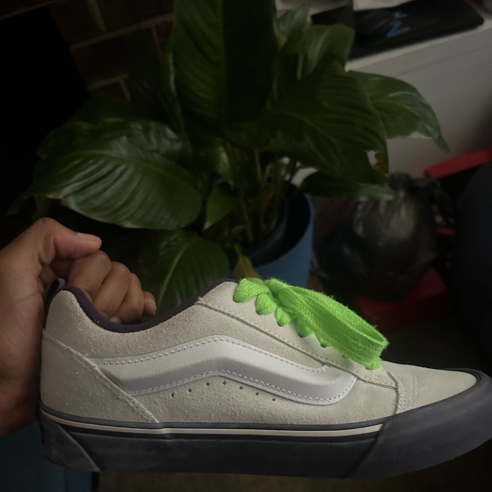 Vans. Size 10 in women’s white and purple with cool shoe strings